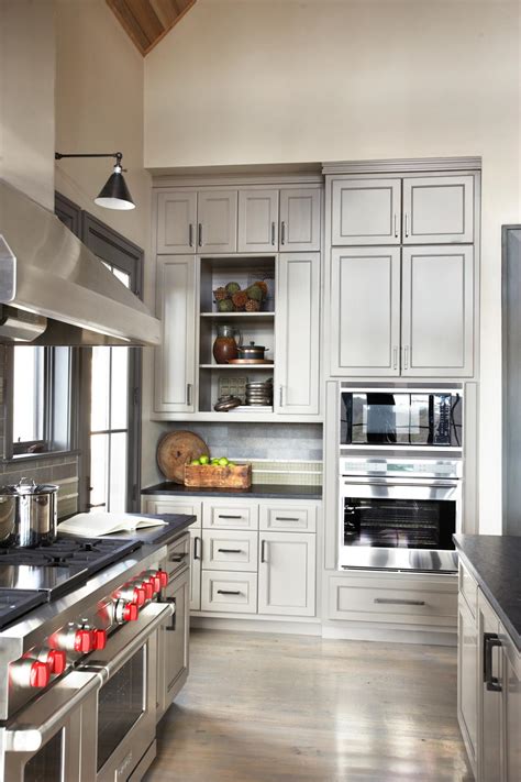 As more homeowners lean toward moodier hues, this rich gray is a solid entry point: Contemporary Gray Kitchen With Large Cabinets | HGTV