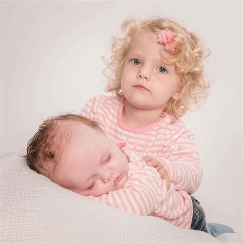 download portrait of cute sister and her sleeping sister wallpaper