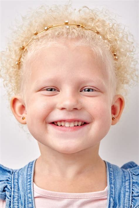 Happy Caucasian Kid Girl Has Broad Smile Shows Perfect Teeth Over