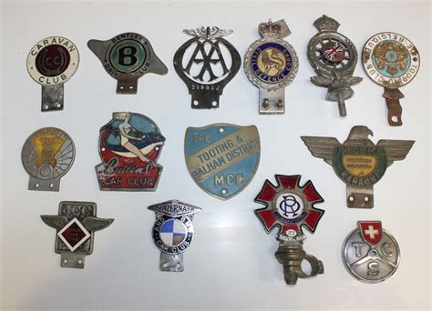 A Collection Of Various Car Badges Including A Royal Automobile Club