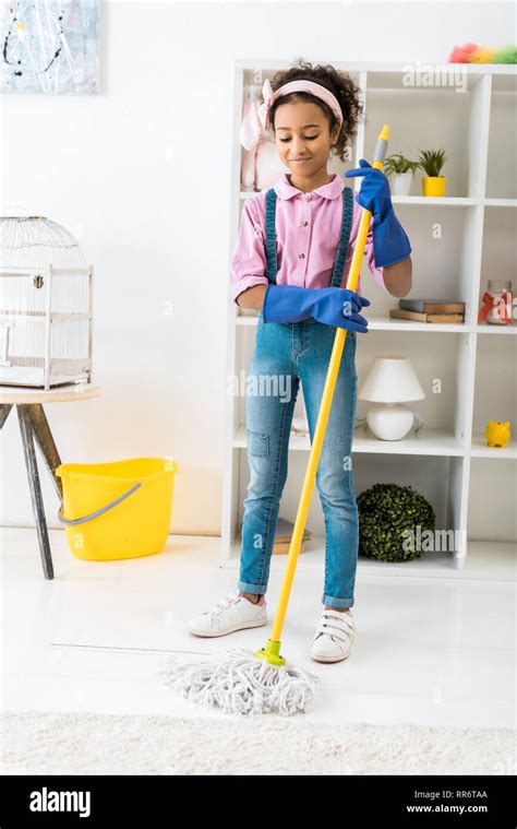 Adorable African American Girl Cleaning Floor With Mop Stock Photo Alamy