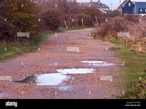 Gravel Wet Unmade Road With Puddles After Rain Stock Photo Alamy
