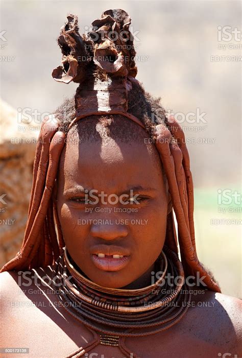 Himba Woman With Ornaments On The Neck In The Village Stock Photo