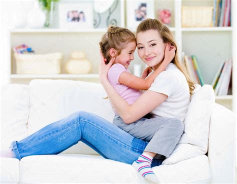 Mother With Daughter Sitting On The Sofa Royalty Free Stock Images