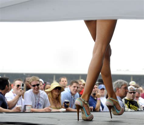 A Bikini Contest Contestant Walks Across The Infield Stage During The