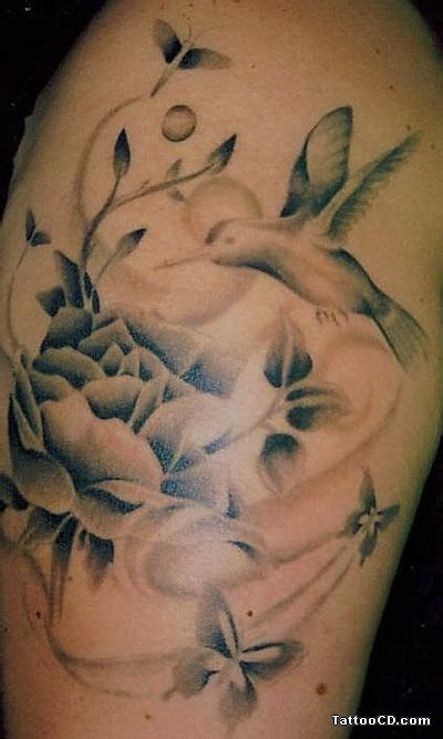 Hummingbirds are the smallest species of birds in the world. Tattoos Of Humming Bird: Hummingbird Flower Tattoos Designs