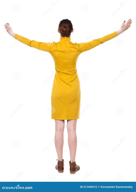 Back View Of Beautiful Woman In Dress Looking At Wall And Holds Stock