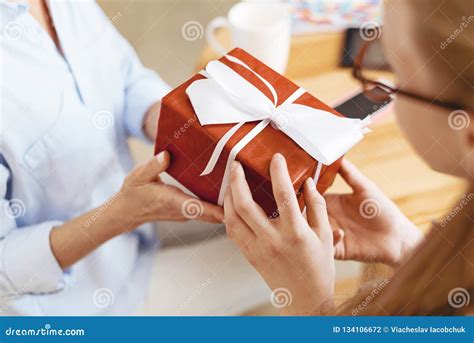 Close Up Of Mother And Daughter Exchanging Ts Stock Photo Image Of