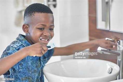 Black Boy Brushing Teeth Photos And Premium High Res Pictures Getty