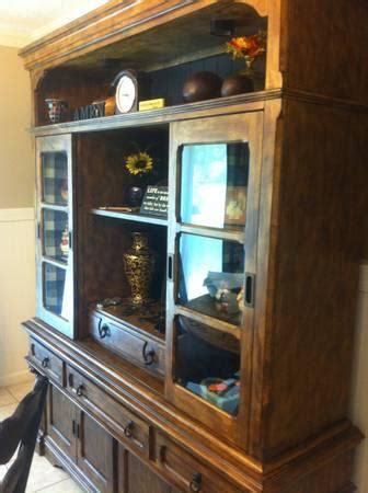 This buffet arrived with a huge chunk of wood missing from a corner and poorly packaged. Ashley furniture Rowley Creek table and buffet with hutch ...