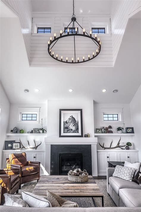 A rustic bedroom showcases vaulted ceilings and a stone clad fireplace. living room with vaulted ceiling detail | Vaulted ceiling ...