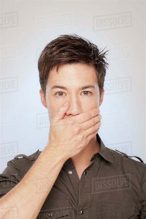 Man Covering His Mouth Stock Photo Dissolve