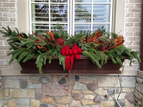 Ferns, evergreens, perennial flowers in red and white, wreathes, ornamental decorations, plants, artificial flowers, poinsettias, jingle balls, ribbons, pine cones, christmas tree trimmings, garland, lights, holly and more are some simple and effective ideas that can be used to decorate your flower boxes. Winter Window Box Display - Traditional - Outdoor Holiday ...