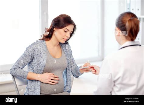 Gynecologist Doctor And Pregnant Woman At Hospital Stock Photo Alamy