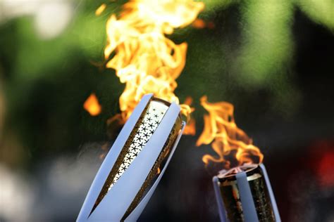 who is lighting the torch at the opening ceremony their identity is being kept under wraps