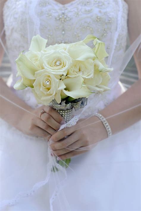Maybe you would like to learn more about one of these? White Rose and Calla Lily Bridal Bouquet