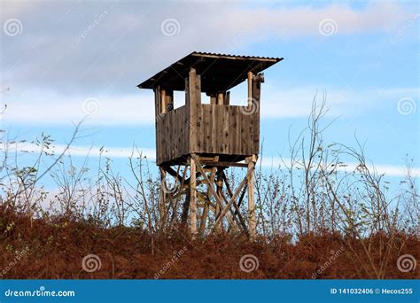 Improvised Old Hunting Lookout Tower Made Of Wood Surrounded With Grass