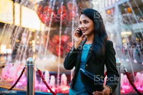 Malaysian Business Woman On The Phone In Downtown Kuala Lumpur Stock