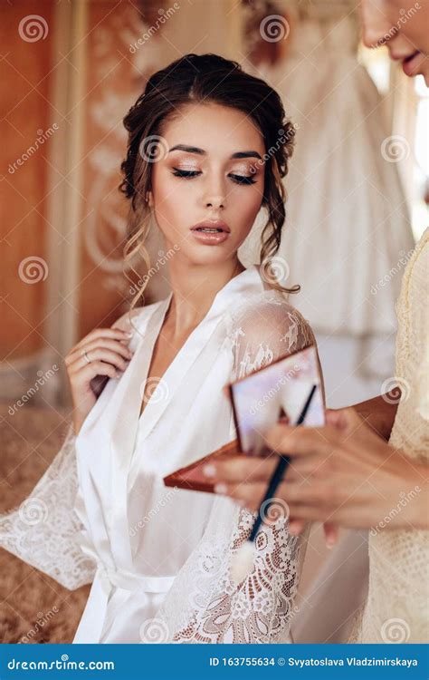 Beautiful Woman With Dark Hair Posing In Silk Robe In The Morning Of