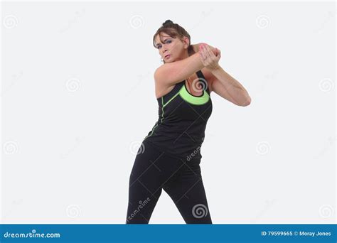 Attractive Middle Aged Woman In Sports Gear Warming Up Her Arm Muscles