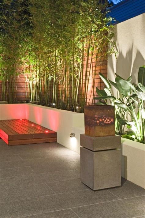 Learn how to plant bamboo, how to grow bamboo, and how to care for bamboo plants. 10+ Enchanting Black Bamboo Fencing Ideas | Garden lighting design, Courtyard design ...