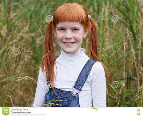 Redhead Little Girl With Freckles Smiles Brightly Stock Photo Image