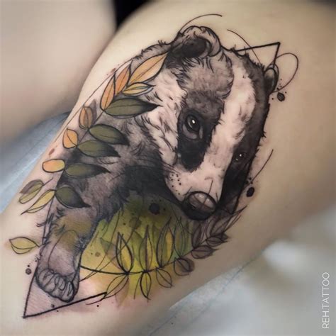 This is a beautiful tribal badger tattoo design where the animal is hiding behind a colourful bush. @reh.tattoo | Badger tattoo, Autumn tattoo, Fantasy tattoos