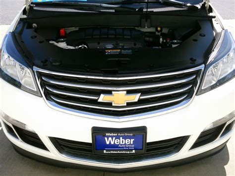 The 2014 chevrolet traverse is a spacious, comfortable, and reasonably responsive vehicle. 2014 White Chevrolet Traverse LT