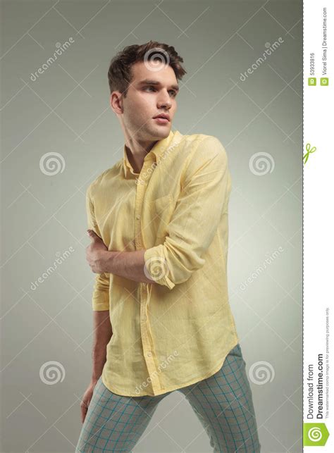 Young Casual Man Holding His Right Arm Stock Photo Image Of Casual