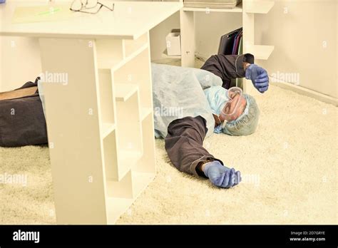 Man Passed Out Shortness Of Breath Man In Protective Equipment Lay On Floor Severe Condition