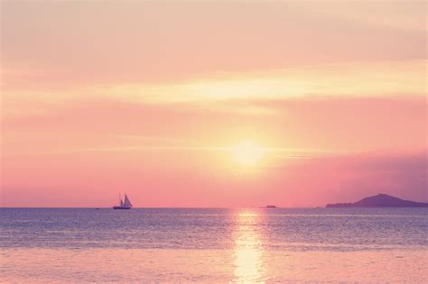 Pastel Tropical Beach Sunset With Sailboat By Janthima C