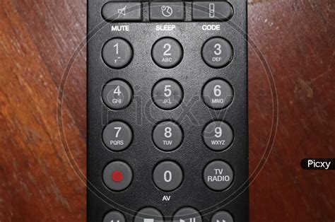 Image Of Close Up View On The Number Keys Of A Television Remote