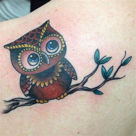 Blue Eyed Red And Yellow Traditional Baby Owl Tattoo On Back Shoulder