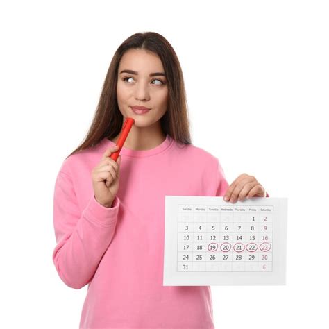 Premium Photo Young Woman Holding Calendar With Marked Menstrual