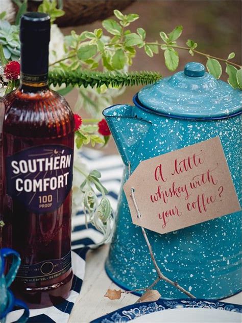 A Bottle Of Southern Comfort Next To A Teapot With A Label On It And