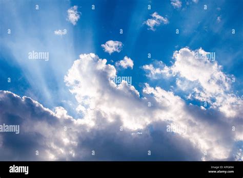 Heavenly Sunrays Through Clouds Stock Photo Alamy