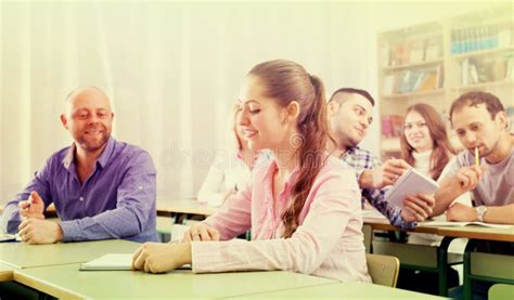Adult Students Writing In Classroom Stock Photo Image Of Clothes