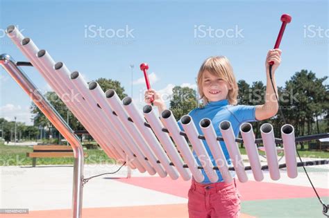 Boy Play Xylophone In Public Park Stock Photo Download Image Now