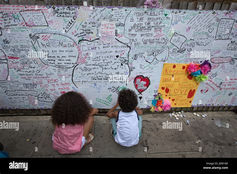 People Leave Tributes On A Wall Off Condolence To The Victims Who Died