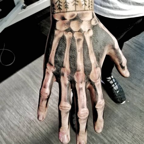 Https://tommynaija.com/tattoo/skeleton Hand Tattoo Designs