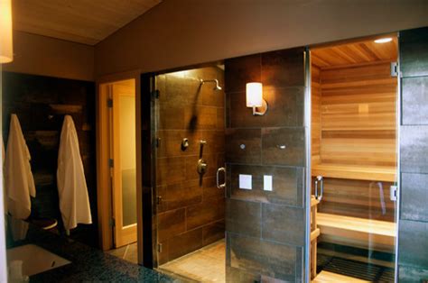 The adjacent sauna is made from medium thermo alder, the darkness creating a stunning contrast with the steam room. Bathroom sauna steam room - Contemporary - Bathroom ...