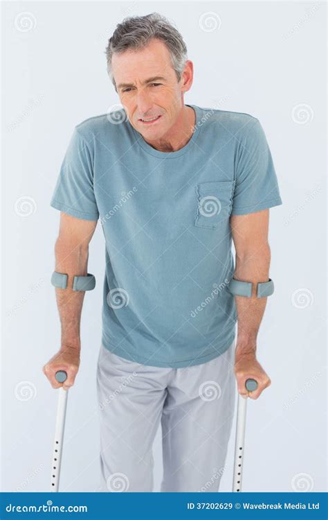 Sad Mature Man With Crutches Stock Image Image Of Standing Relax