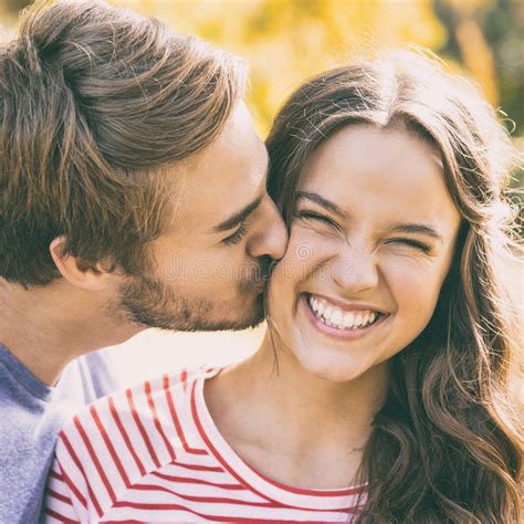 Cute Couple Kissing In The Park Stock Image Image Of Embracing