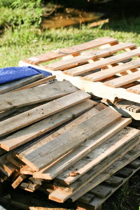 How to build a raised garden from wood pallets. How to Make Raised Beds Cheaply From Pallet Wood | Lady ...