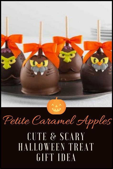 Chocolate Covered Candies With Orange Bows And Pumpkin Heads On Them