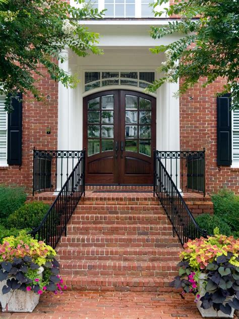 Deck stair landing design ideas increase homes seal front stairs designs landings. Traditional Front Door with Brick Stairs and Container Plants | Wrought iron front door, Iron ...