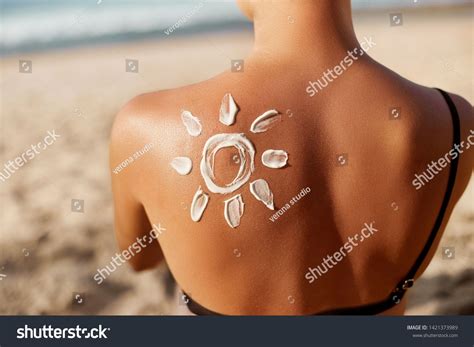 Woman Applying Sun Cream On Tanned Shoulder In Form Of The Sun Sun Protectionsun Cream Skin