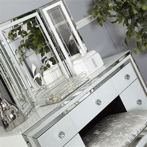 Smooth materials such as glass are a good choice if you like cleaning to be fast and easy. Madison White Glass 7 Drawer Mirrored Dressing Table | Picture Perfect Home