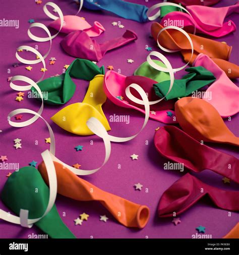 Festive Background Of Purple Material Colorful Balloons Streamers