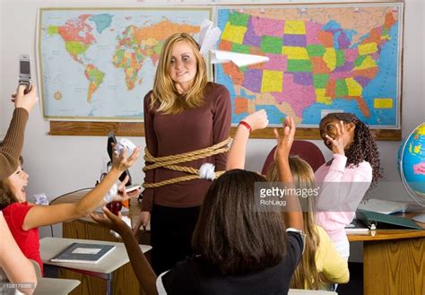 A Teacher Who Is Tied Up In The Middle Of An Unruly Classroom Of Substitute Teaching